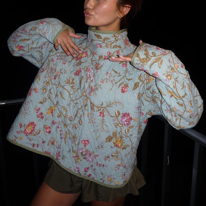 Light blue floral quilted mockneck